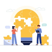 two people working together on a puzzle light bulb