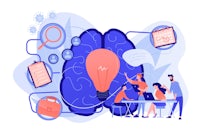 a group of people sitting around a table with a brain in the middle